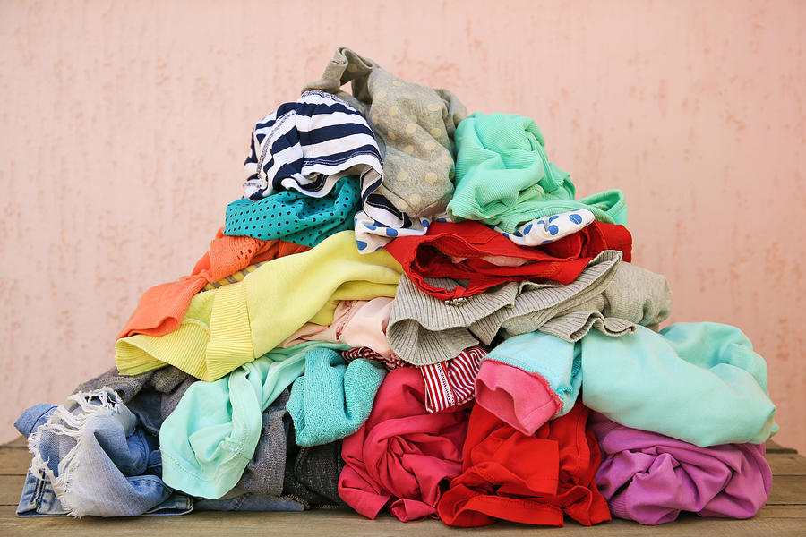 Pile of carelessly scattered clothes. Photograph by Mukhina1