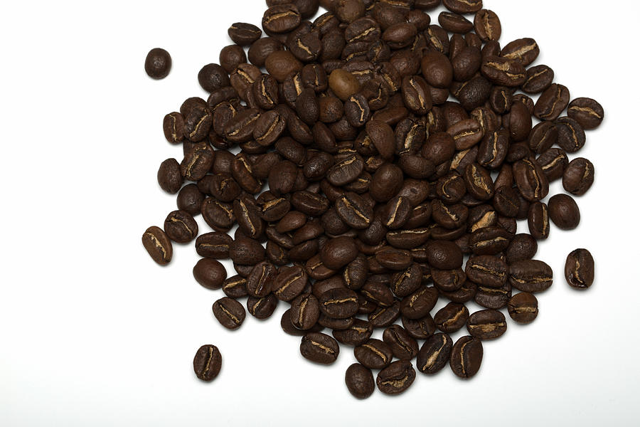 Pile of Coffee beans on a white background Photograph by Jean-Marc PAYET