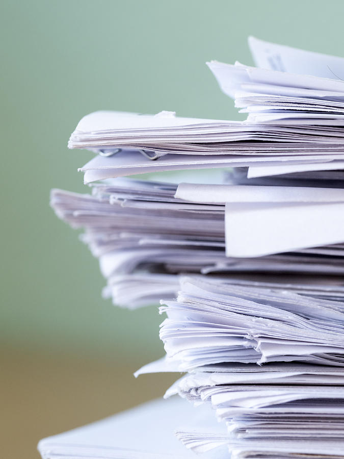 Pile of papers on a work table. Photograph by Jose A. Bernat Bacete