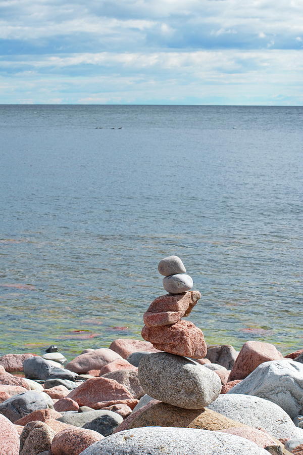 Pile of round stones at the shore of the ocean Photograph by Ulrich Kunst And Bettina Scheidulin