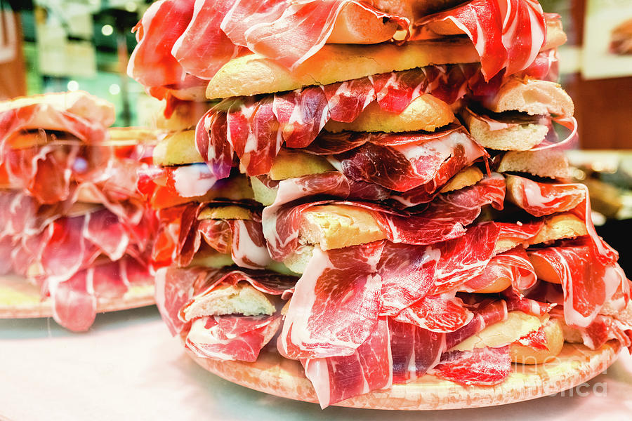 Pile of serrano ham sandwiches, typical Spanish sandwich, for to Photograph by Joaquin Corbalan