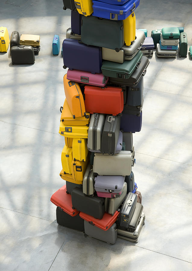 Pile of suitcases Photograph by Michael Dunning