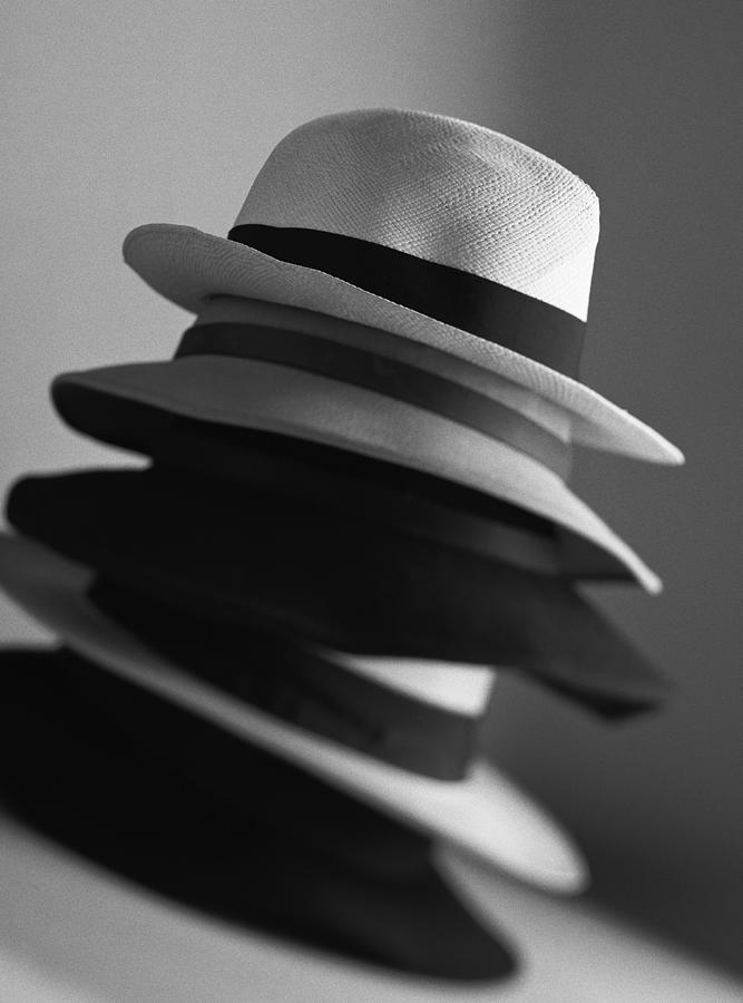 Piled up hats, close-up, b&w Photograph by Christian Zachariasen