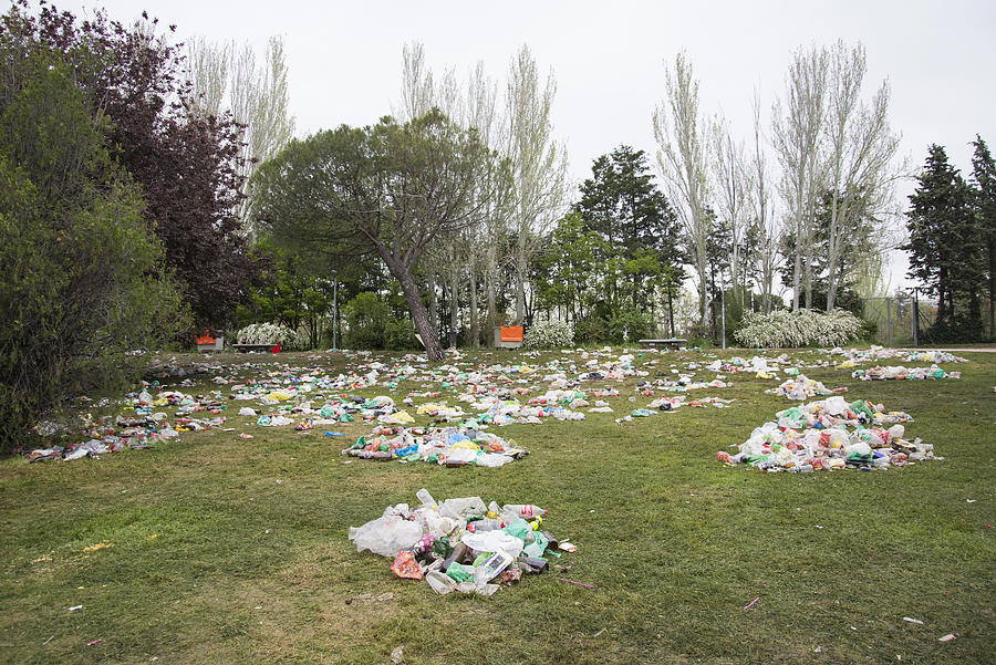 Piles of garbage on a park after street drinking Photograph by Carlos Ciudad Photos