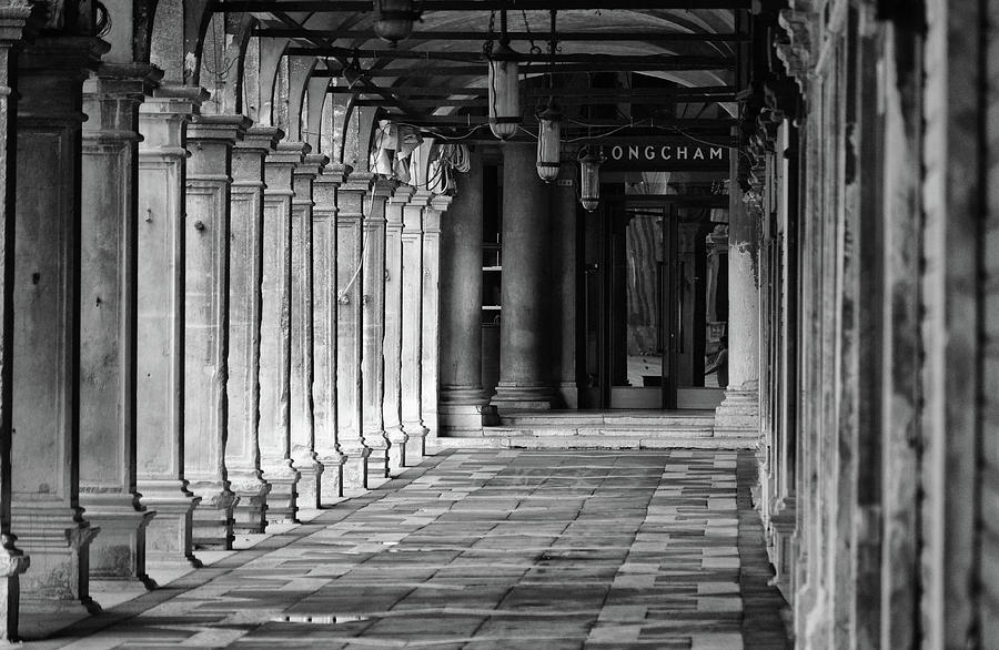 Pillared Colonnade in St. Marks Square Piazza San Marco Venice Italy Black and White Photograph by Shawn OBrien