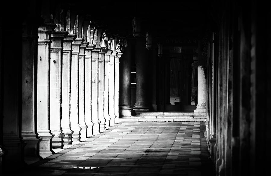 Pillared Colonnade in St. Marks Square Piazza San Marco Venice Italy Noir Black and White Photograph by Shawn OBrien