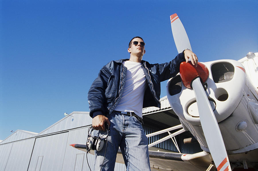 Pilot Standing by a Propeller Aeroplane Photograph by Chris Sattlberger