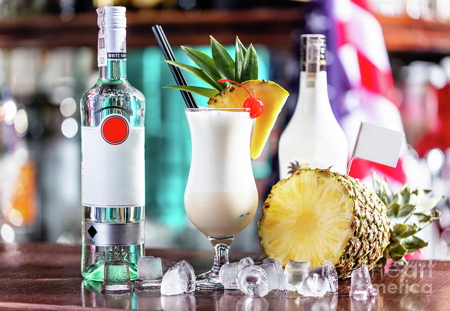 Pina colada coctail on bar counter Photograph by Michal Bednarek