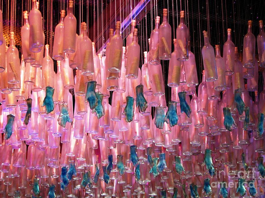 Pink Bottles and Blue Hands Photograph by Rosanne Licciardi