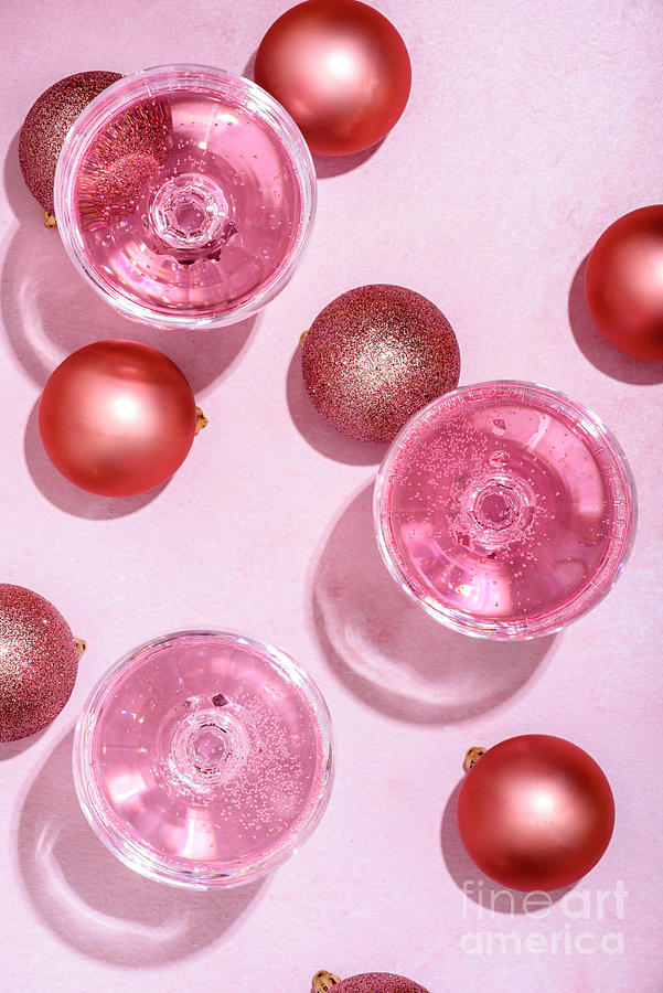 Christmas Photograph - Pink champagne in luxury crystal glasses and christmas baubles w by Jelena Jovanovic
