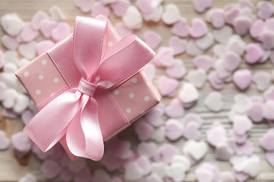 Pink gift box on abstract background Photograph by Tedestudio