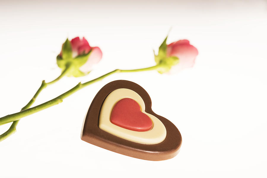 Pink roses and heart shaped chocolate Photograph by ZAKmac