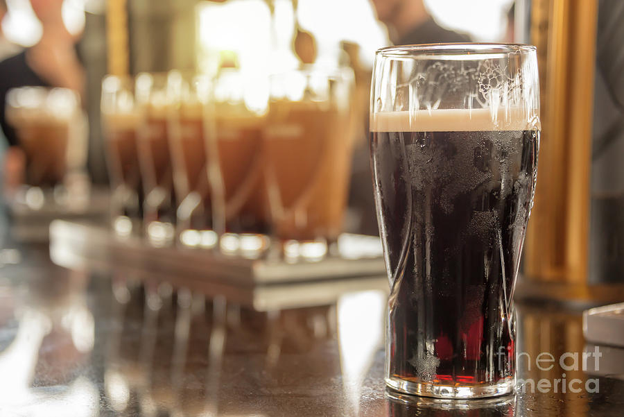 Beer Photograph - Pint of Guinness stout beer by Delphimages Photo Creations