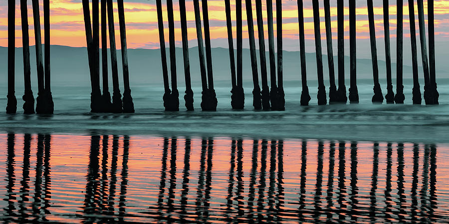 Mountain Landscape Photograph - Pismo Beach Pier Piling Silhouettes and Coastal Mountain Panorama by Gregory Ballos