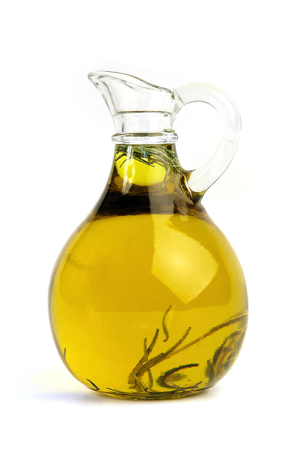 Pitcher of olive oil with rosemary Photograph by Mashabuba