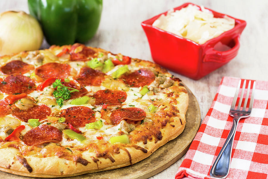 Pizza Pie With Pepperoni and Onion and Green Pepper Photograph by Carol