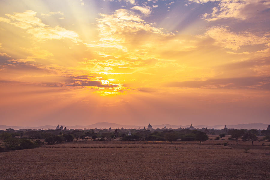 Plains of Bagan at sunset Photograph by Tom Dimambro - Fine Art America