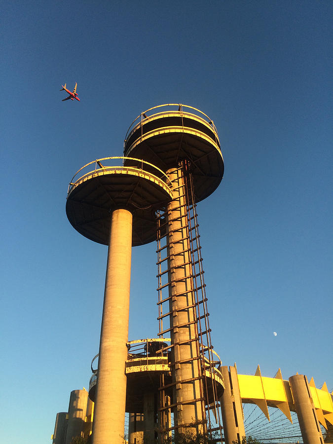 Plane flying past historic 1964 Worlds fair New York State Pavilion, Queens, NY Photograph by Lindsey Nicholson