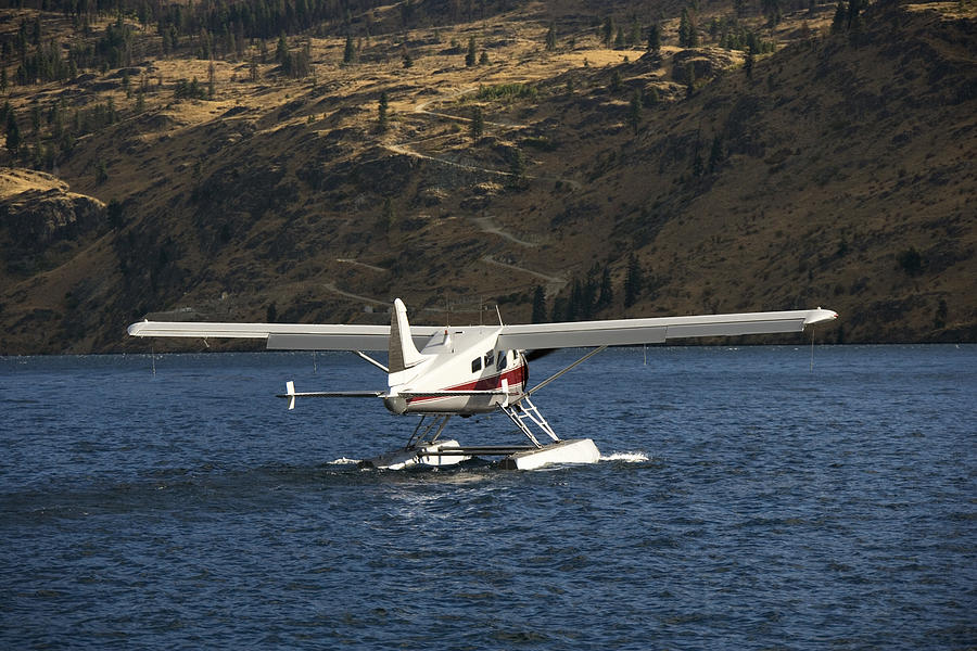 Plane on lake Photograph by Jupiterimages