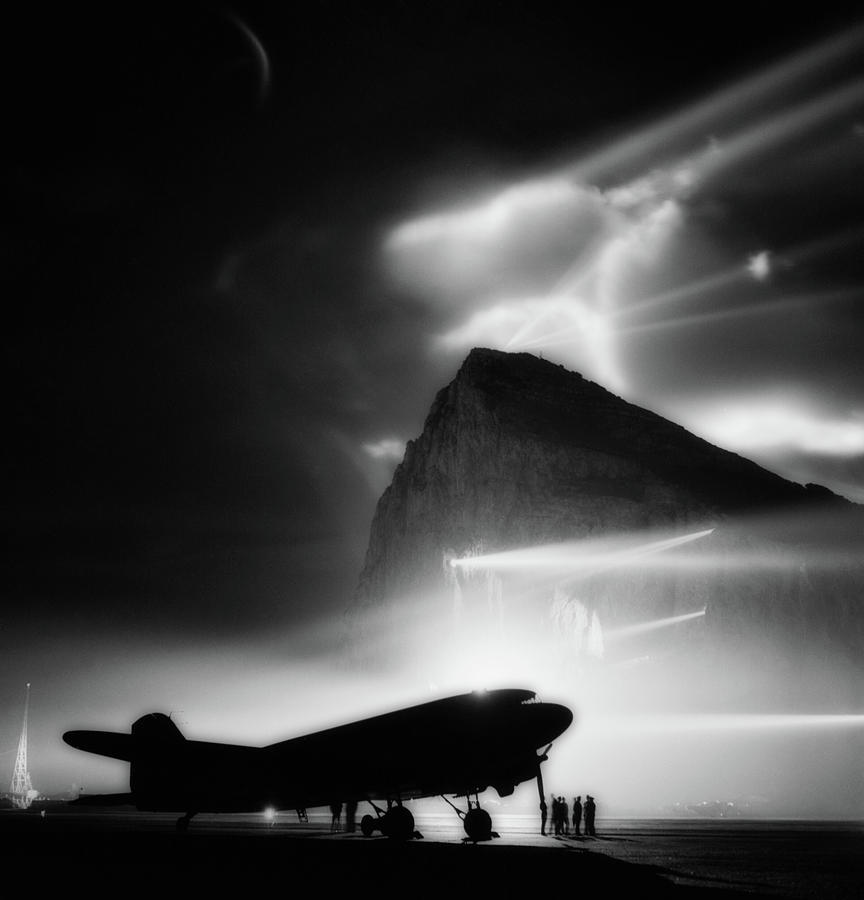 Black And White Photograph - Plane Silhouetted By Searchlights On The Rock Of Gibraltar by Mountain Dreams