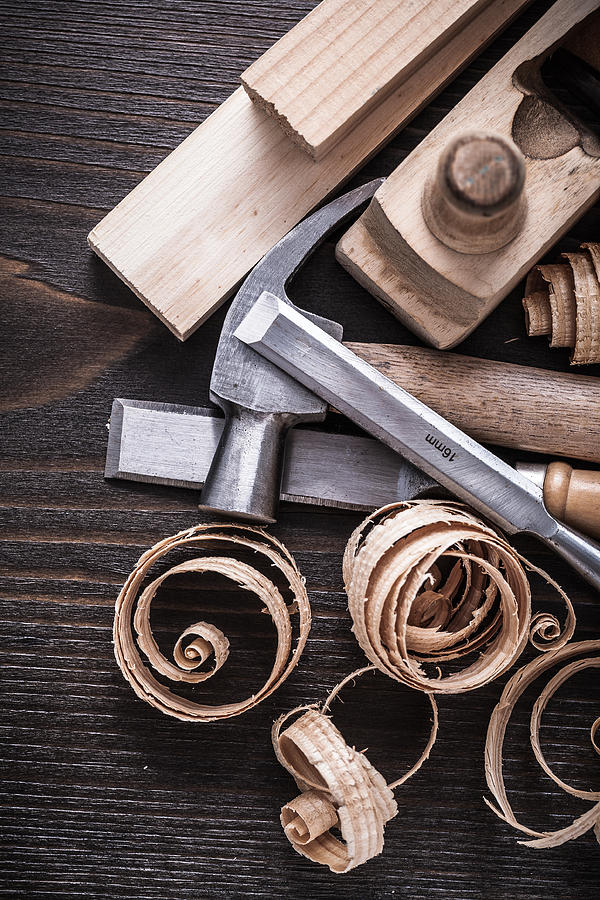 Planer hammer chisels wooden studs and curled shavings on vintag Photograph by Mihalec