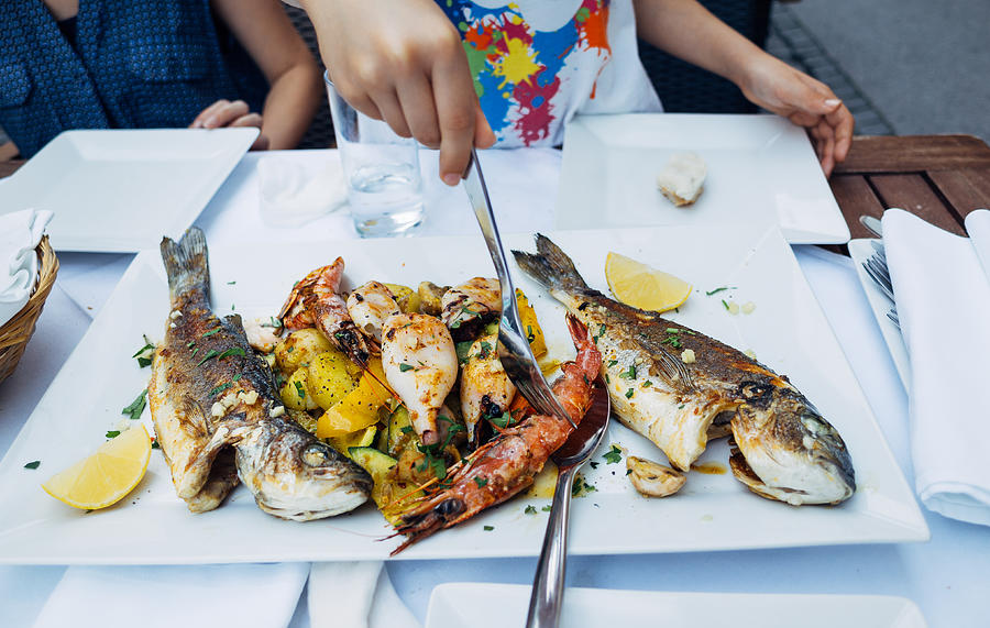 Plate of grilled seafood Photograph by © Peter Lourenco