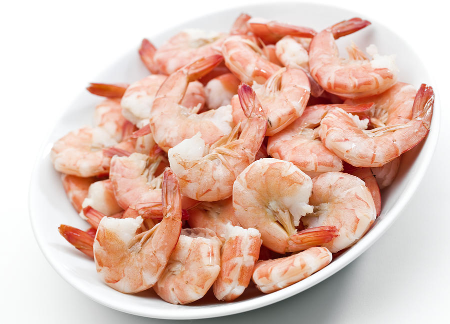Plate of shrimps on white background Photograph by Juanmonino