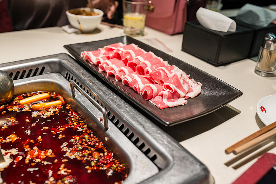 Plate of Thin Sliced Beef (Beef Rolls) and Spicy Sichuan Hot Pot Photograph by AerialPerspective Images