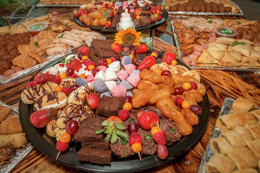 Plates of food and snacks for a party event Photograph by Ronel BRODERICK