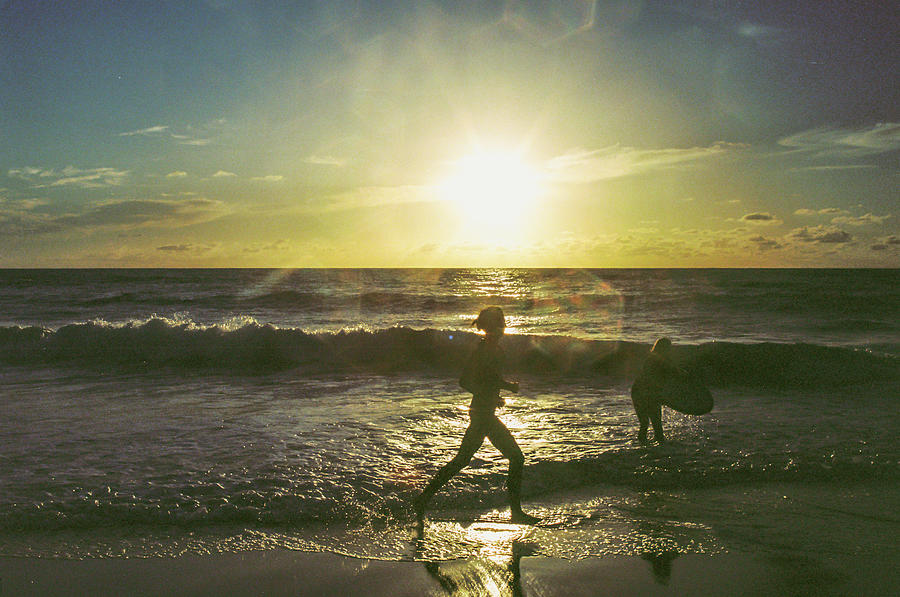 Play at the beach Photograph by Barthelemy de Mazenod