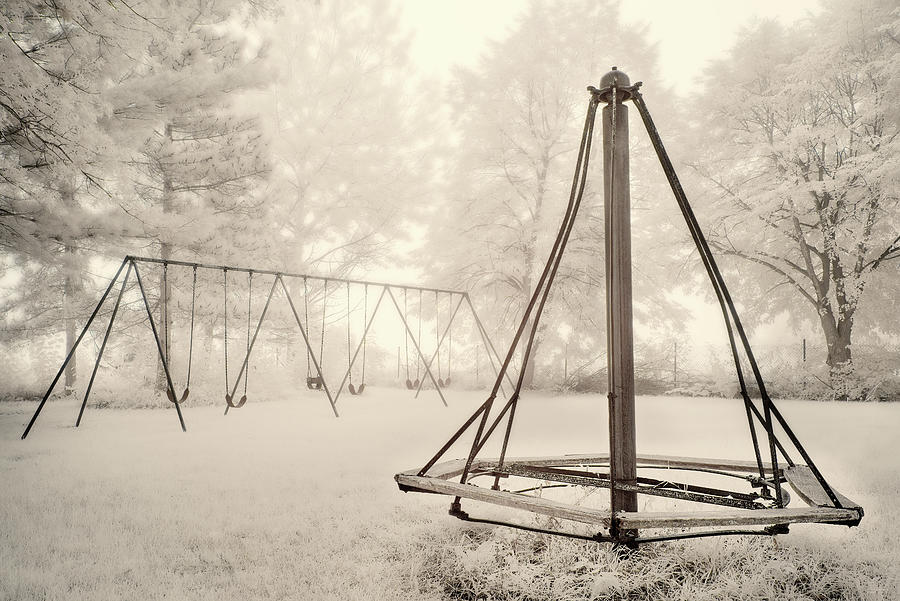 Playground Memories - swings and witches-hat merry go round at Cooksville WI schoolhouse in infrared Photograph by Peter Herman