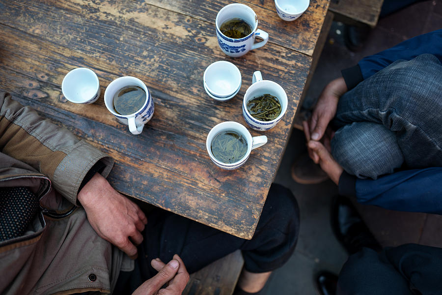 Playing CARDS and drinking tea in a teahouse Photograph by Jun Xu