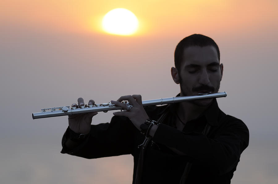 Playing Flute Photograph by Emreogan
