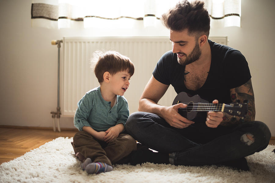 Playing his favorite song Photograph by Georgijevic