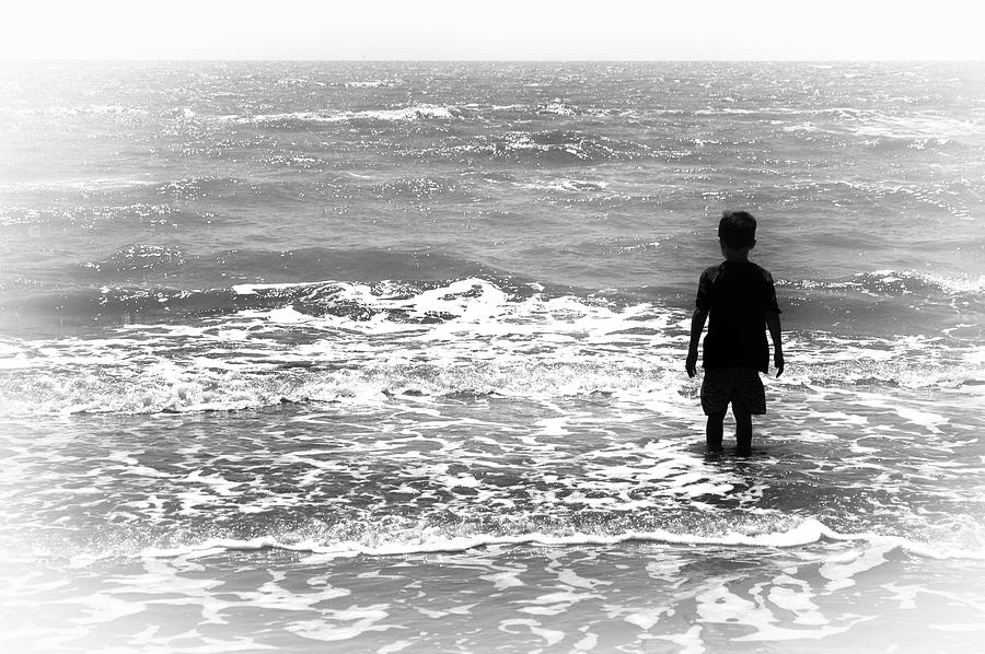 Kid Playing in the Surf Photograph by James C Richardson