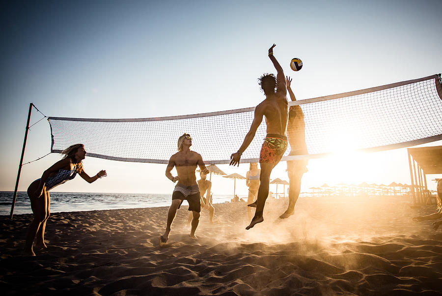 Playing volleyball on the beach! Photograph by Skynesher