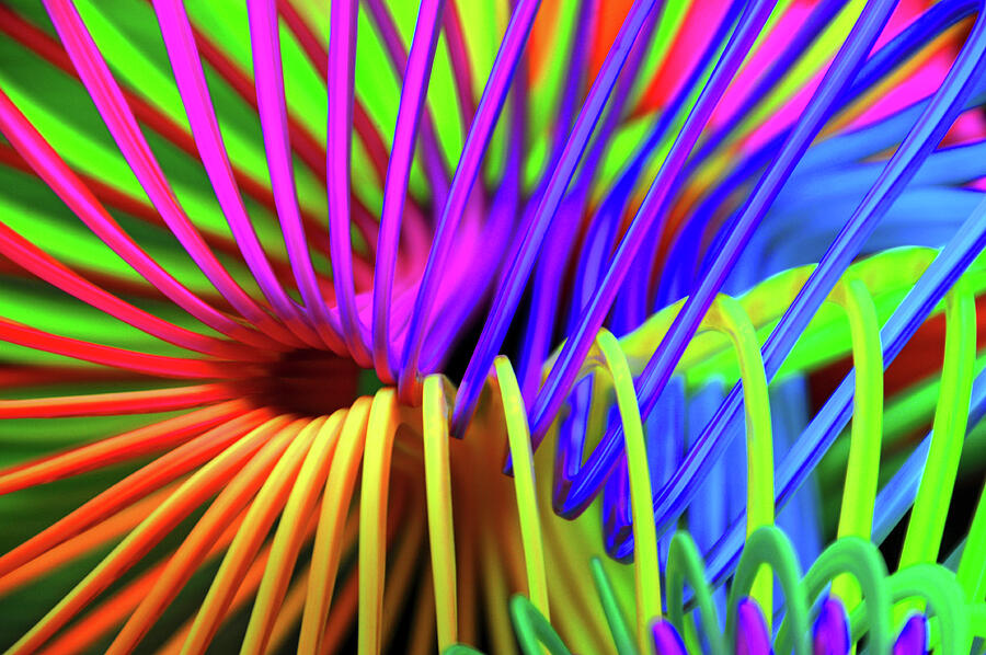Playing with a Slinky Photograph by Mike Martin