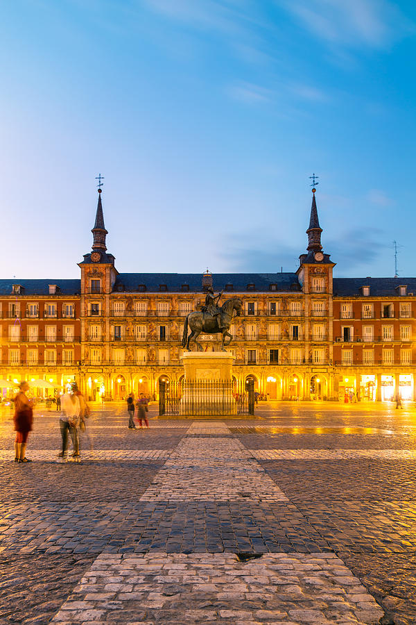 Plaza Mayor with famous statue at dusk, Madrid Photograph by Matteo Colombo