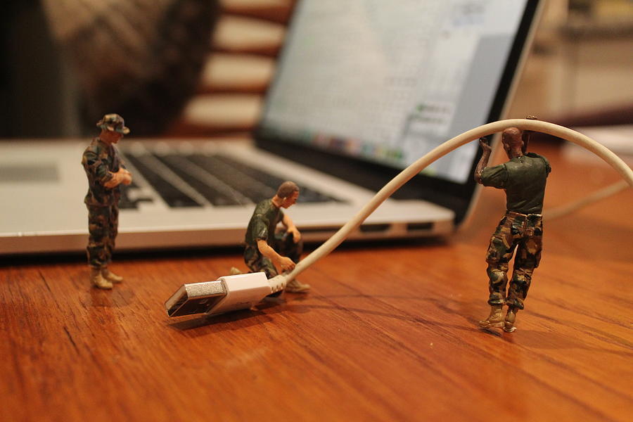 Plugging In Photograph by Army Men Around the House
