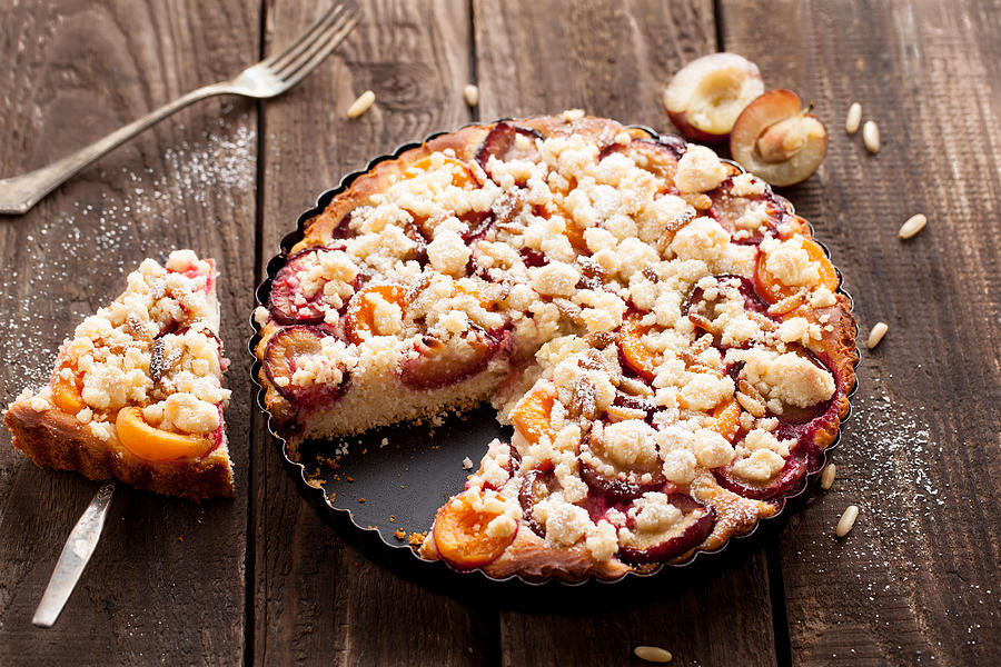 Plum cake with pine nuts Photograph by Carolafink