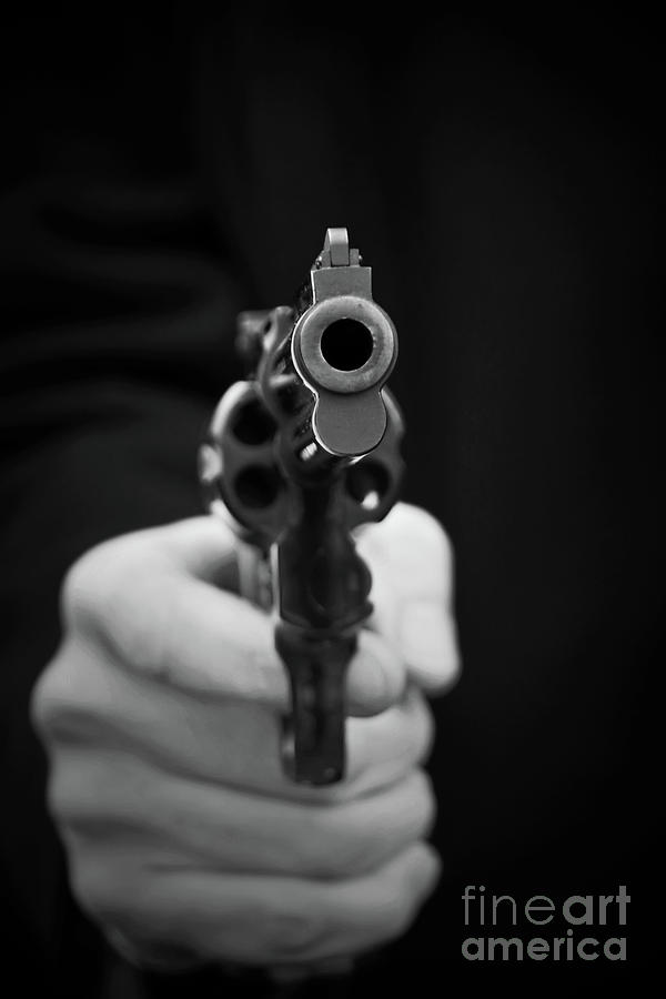 Pointing a gun Photograph by Delphimages Photo Creations