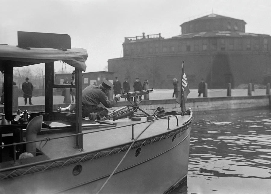 Police Officer Manning A Machine Gun On A Patrol Boat -  Circa 1915 Photograph