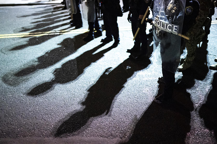 Police shields and shadows at activist protest Photograph by E4c