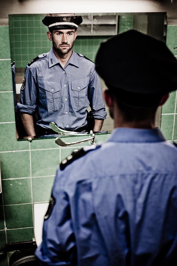 Policeman Sees Himself In A Mirror In Rotten, Abandoned Bathroom Photograph by Fotografixx
