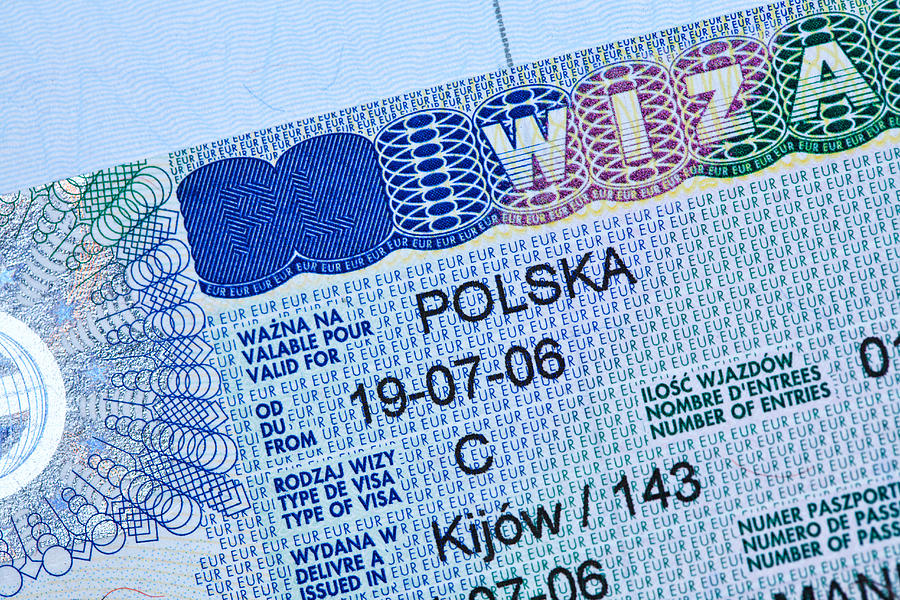 Polish visa stamp in a passport Photograph by Ravi Tahilramani