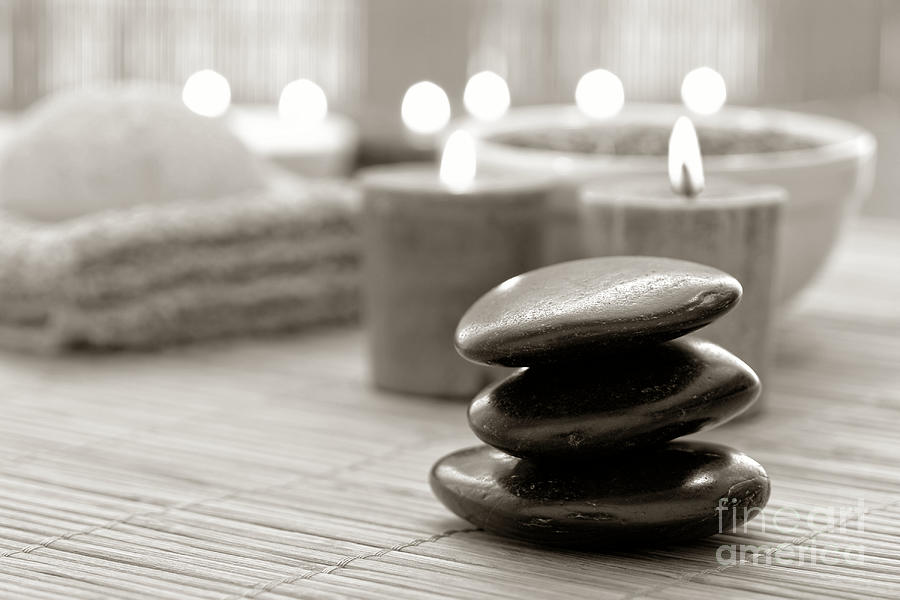 Polished Stone Cairn and Candles Burning in a Spa Photograph by Olivier Le Queinec