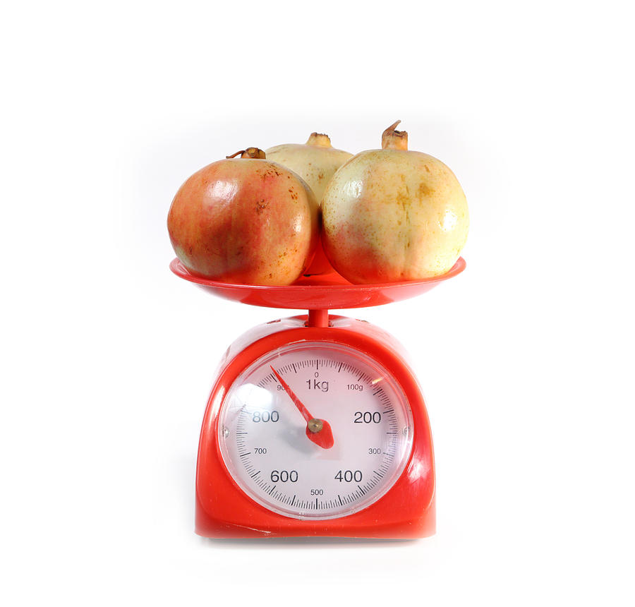 Pomegranate On Red Weighing Scale Photograph by Ko_orn