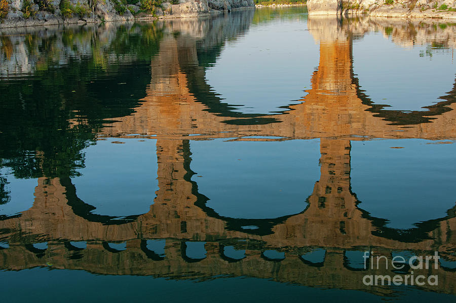 Pont du Gard Reflection in the Gardon River Photograph by Bob Phillips