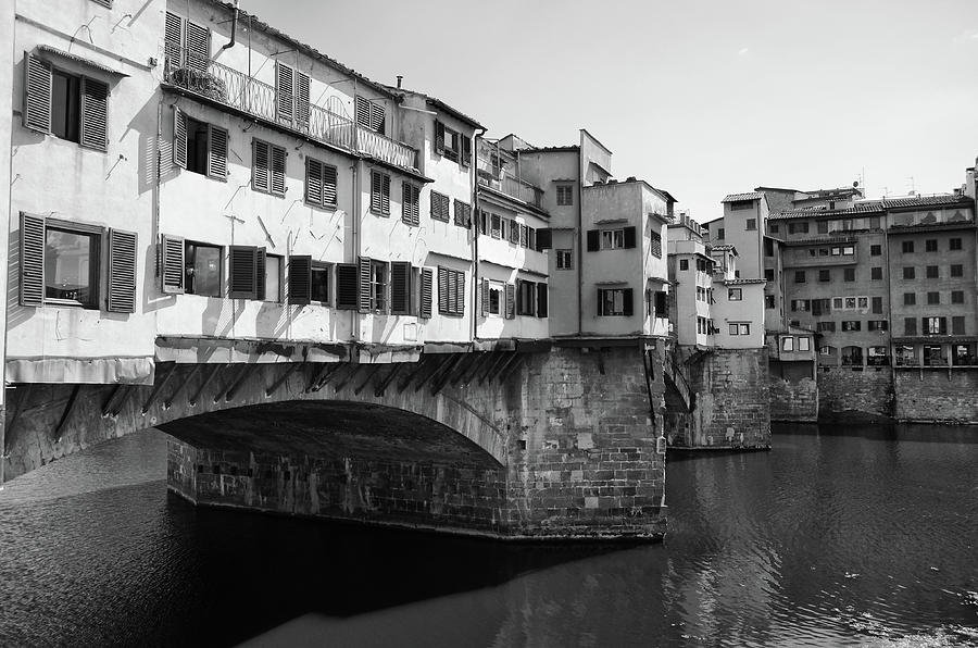 Ponte Vecchio Shops above River Arno Florence Italy Black and White Photograph by Shawn OBrien