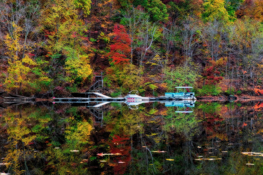 Pontoon boat on the water in Fall Photograph by Dan Friend